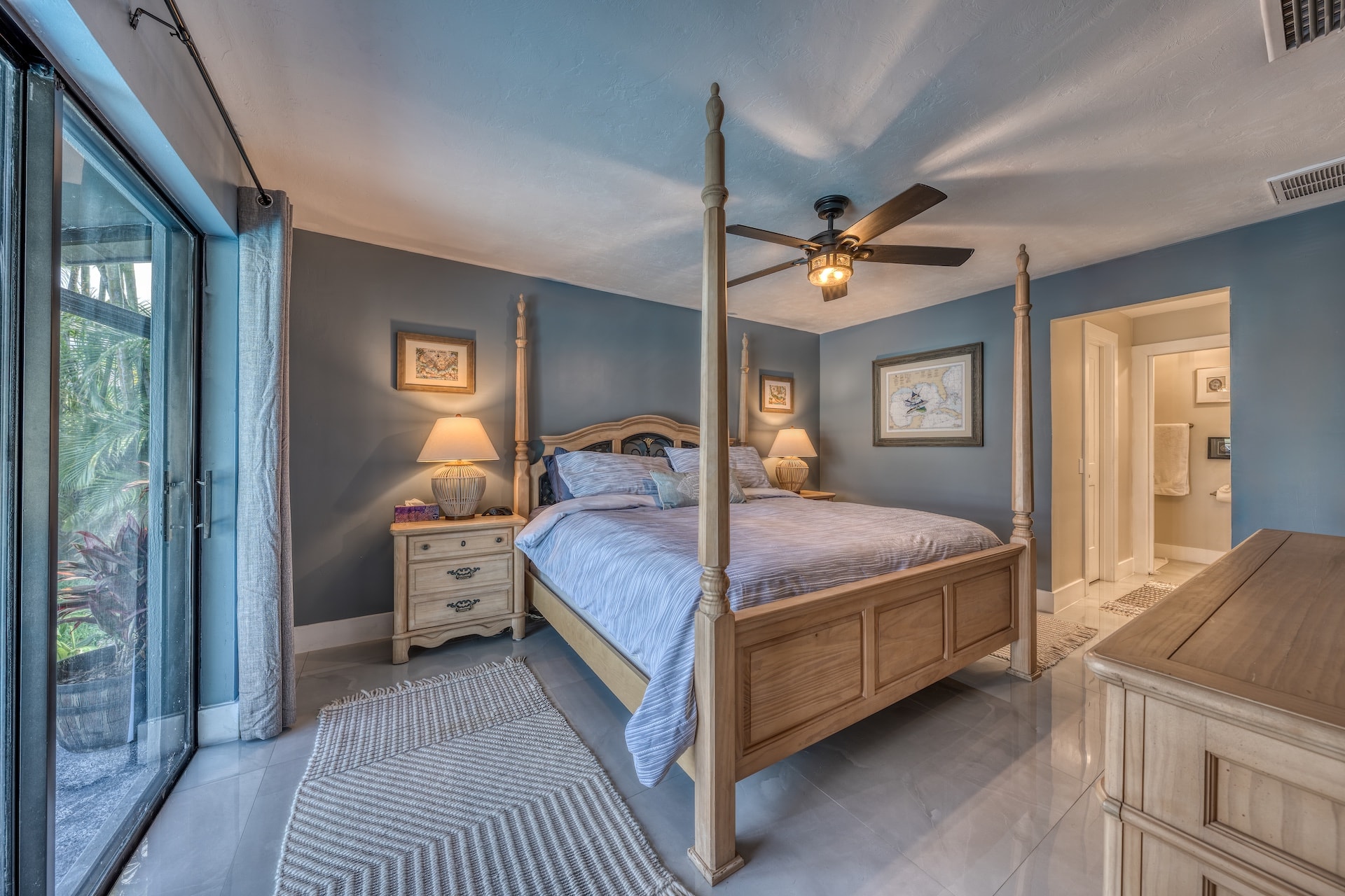Spacious bedroom with four poster bed