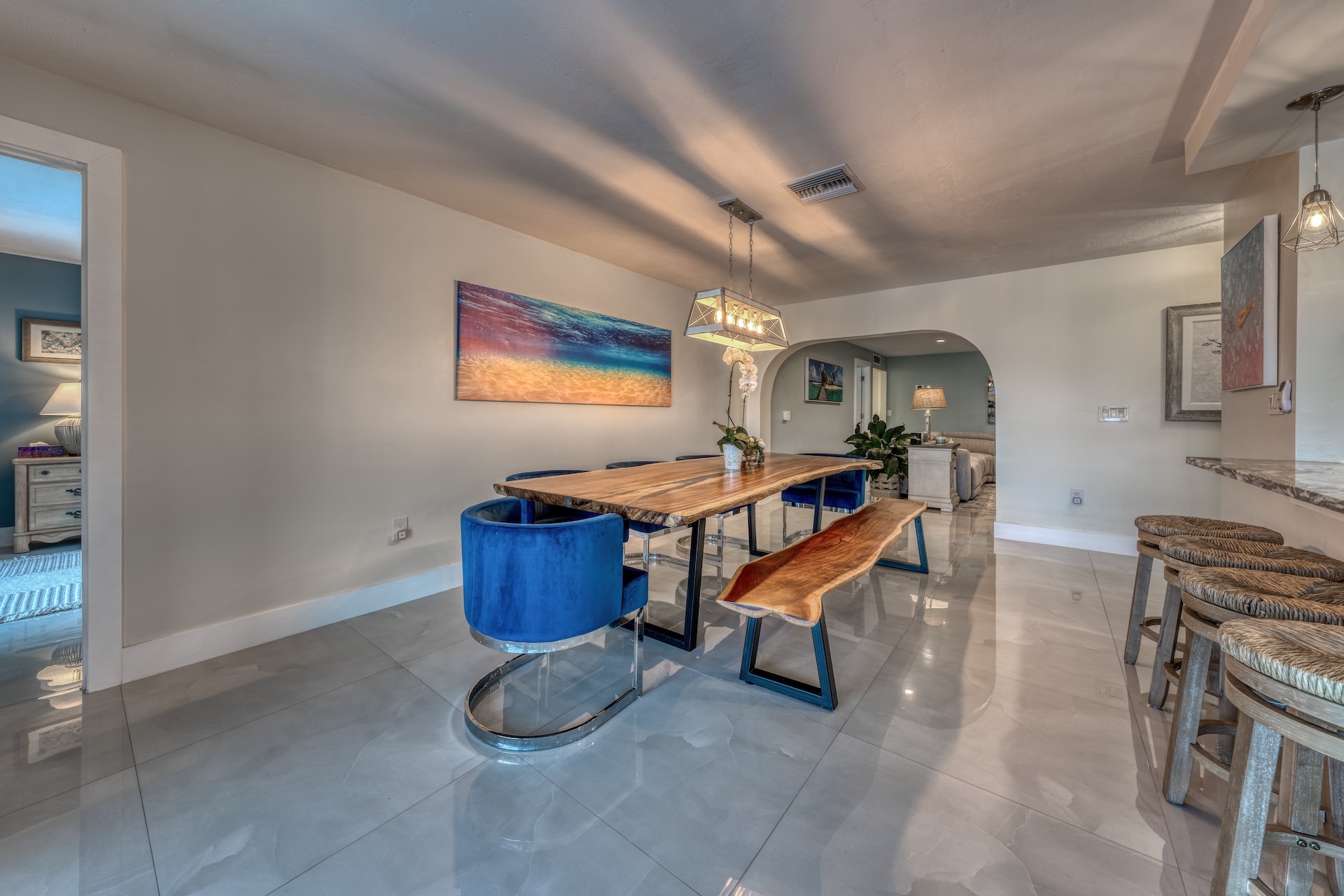 Modern dining room with wood table and blue chairs