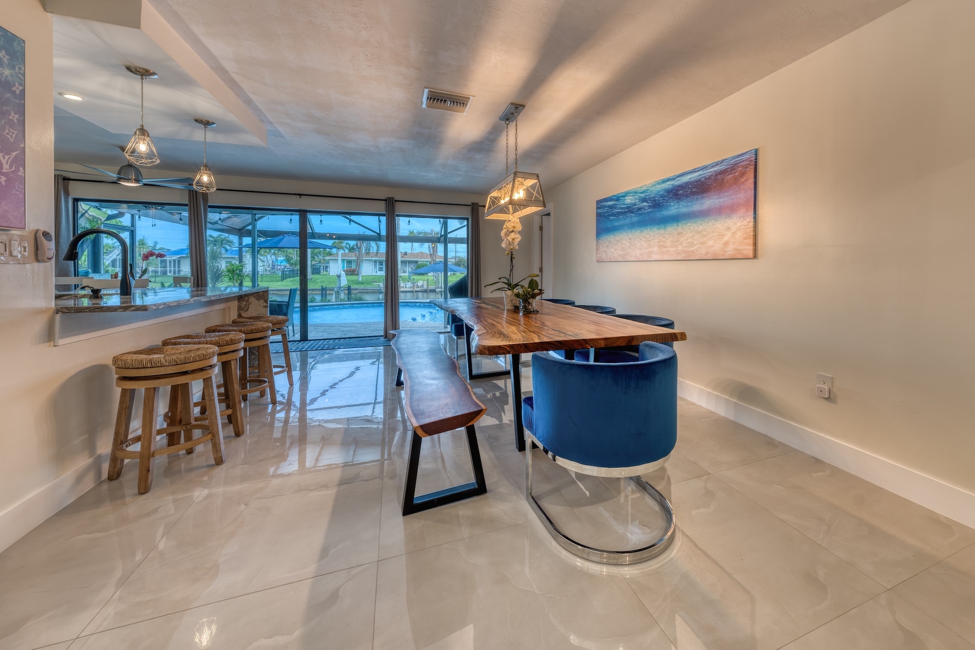 Modern kitchen dining room with pool view