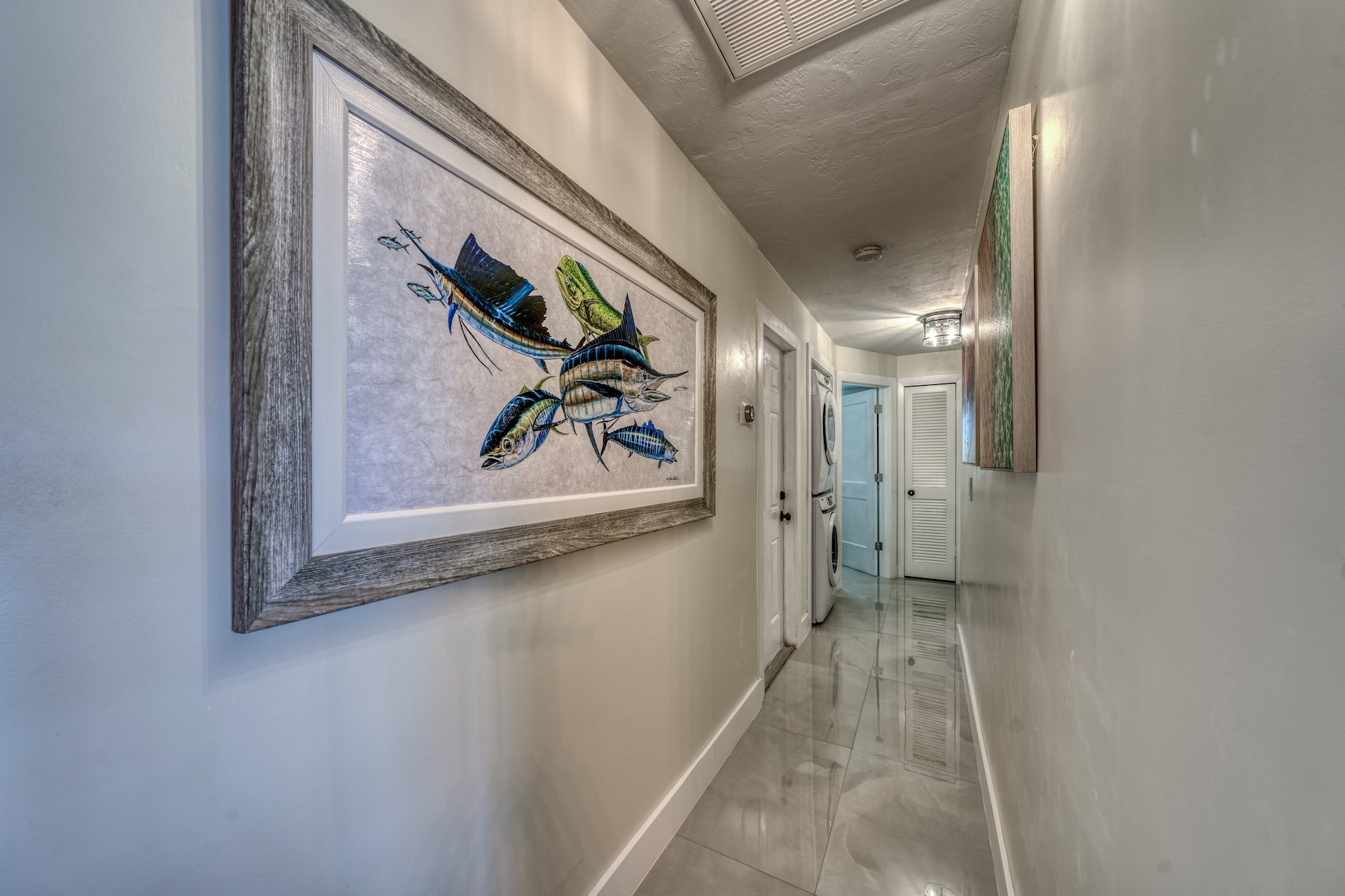 Hallway with coastal artwork