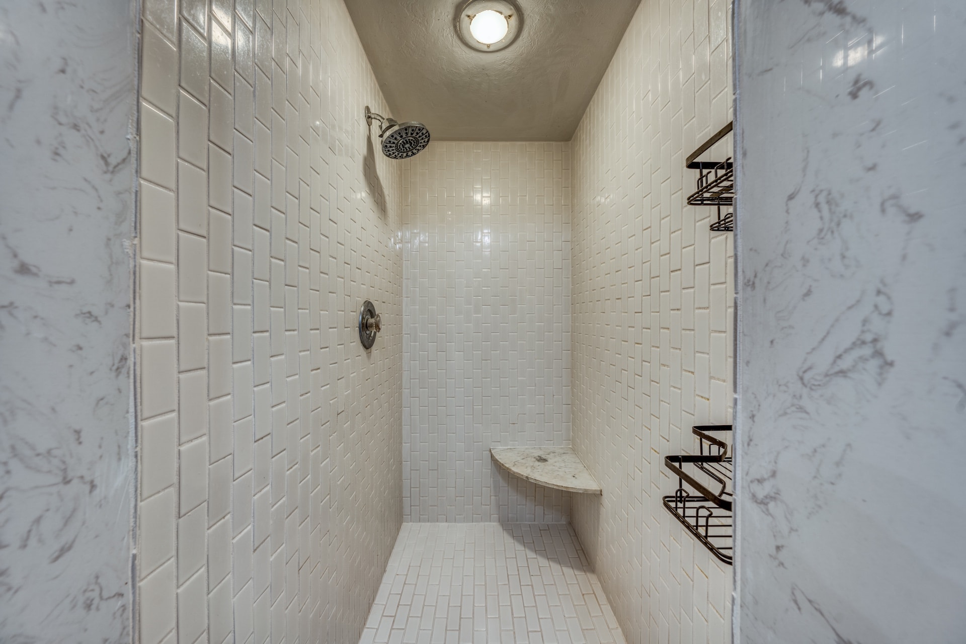 Bathroom shower with white subway tile