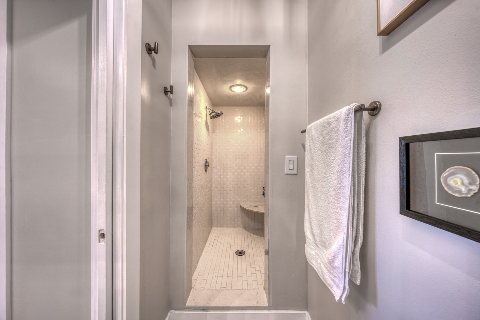 Walk-in shower with towel rack