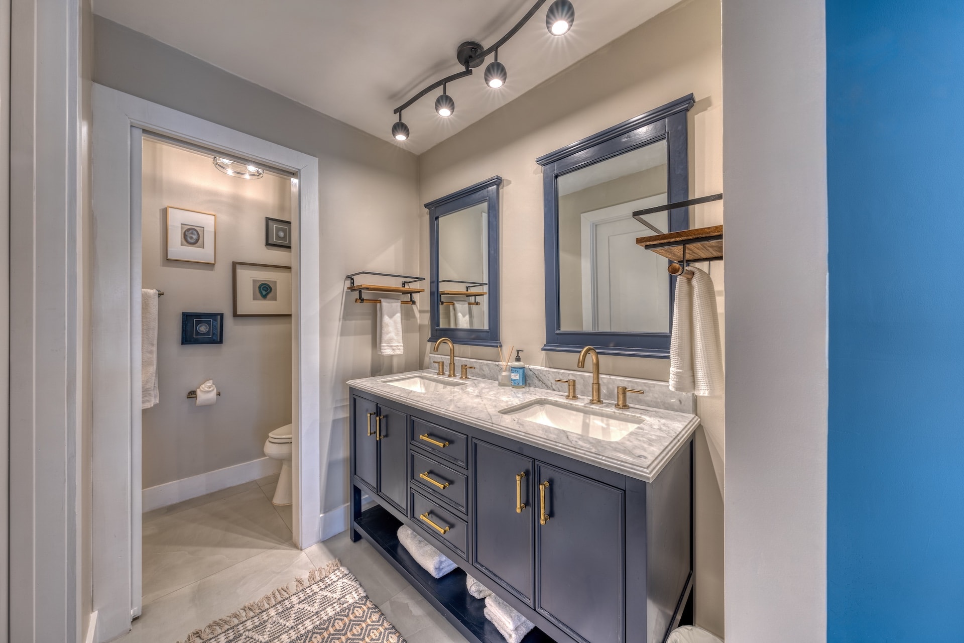 Dual vanity bathroom with mirrors
