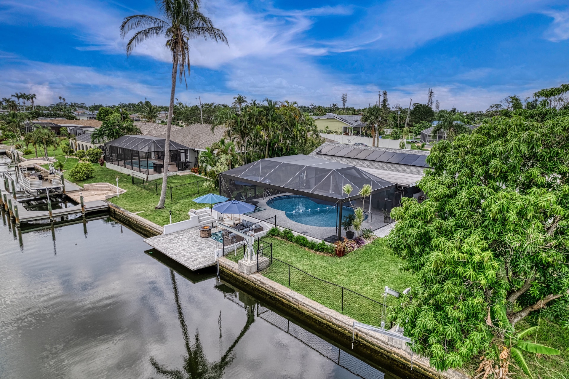 Covered pool with modern house and patio