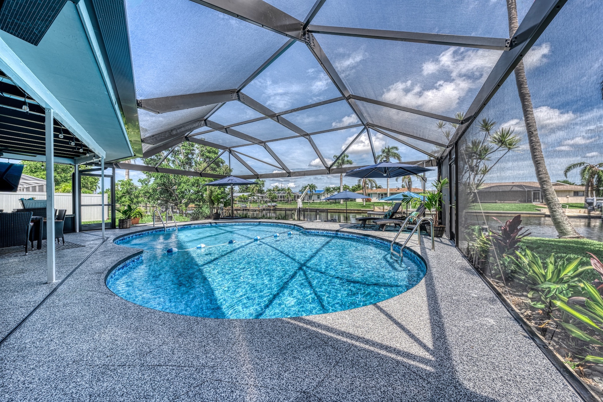 Screened pool enclosure with waterfront view