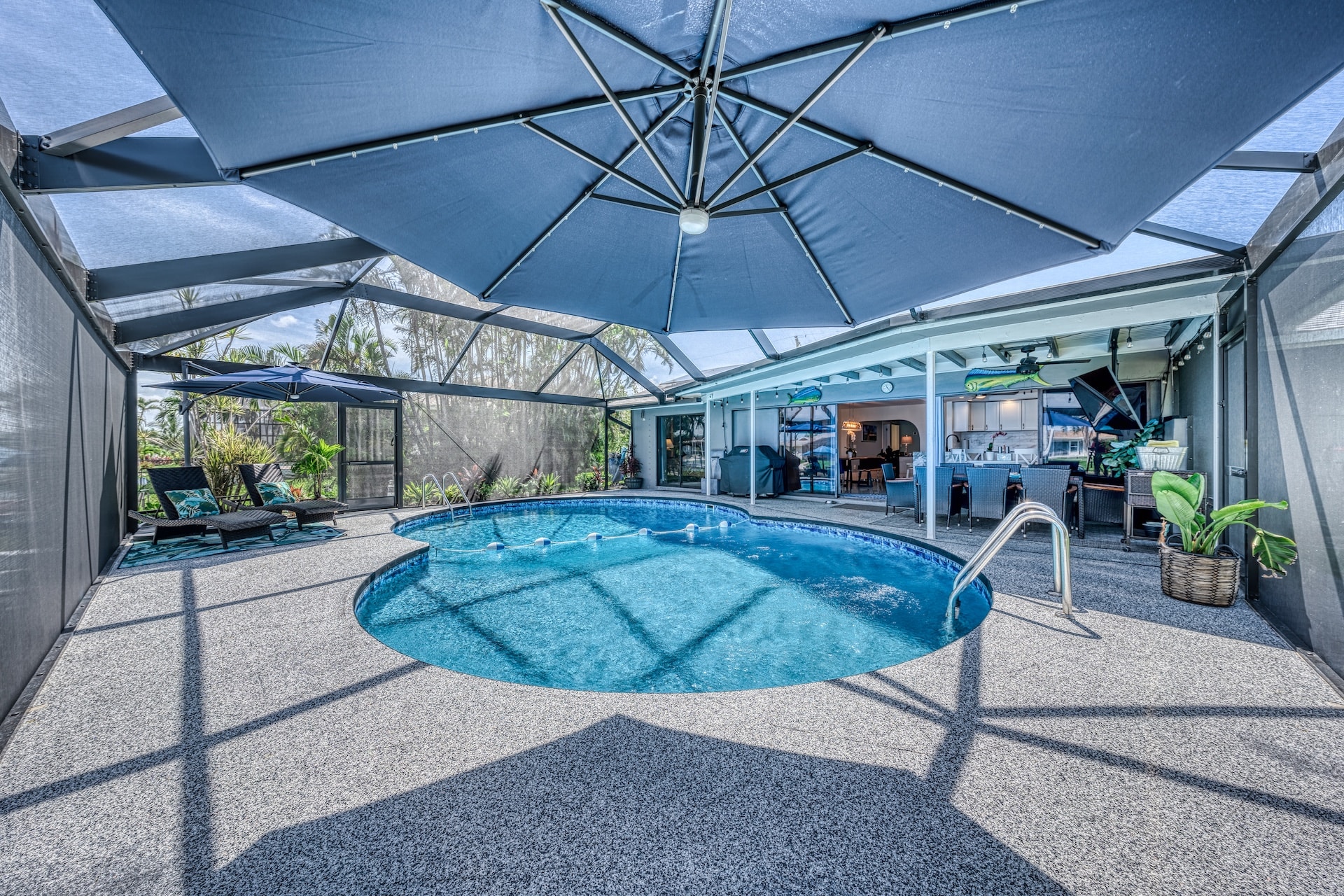 Covered pool with blue umbrella shade